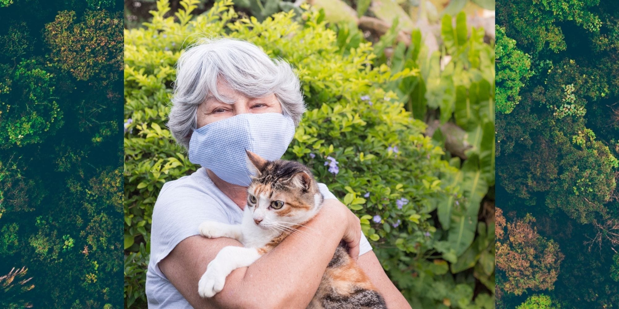 Older woman wears face mask while holding cat.